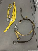 Overview of all three straps laid out on floor