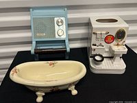 front view of all three items: bathtub dish, Gloria radio, talking tissue holder
