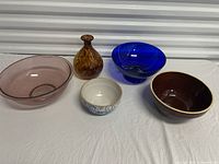 Group shot of five bowls and vase