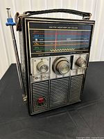 Front view of Soundlite radio showing band scale, knobs, speaker grille and power switch