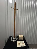 Full view of coat rack and book set on table
