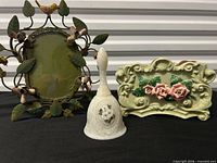 Group shot showing bell, frame and holder together