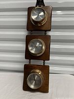 Full view of three-dial hanging weather station