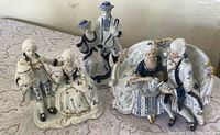 All three porcelain couple figurines on tabletop