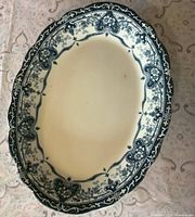 Top view of oval cream and blue Rothesay pattern platter