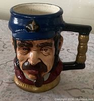 Front view of ceramic sea captain beer mug