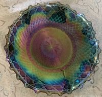 Top view of blue iridescent carnival glass dish showing diamond pattern and iridescence