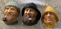 Front view of all three Bossons chalkware heads