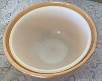 Nested view showing both bowls, peach outer and white inner