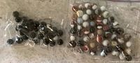 Two bags of marbles, full lot view