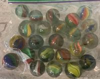 Bag of cat eye marbles, showing quantity and colors