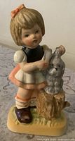 Front view of Lefton girl and puppy figurine