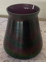 Side view showing iridescent exterior and form