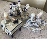 All three porcelain figurines grouped together