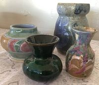 Group shot of all four vases showing sizes, shapes and glazes