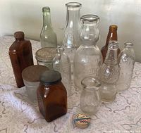 Group shot of all vintage bottles and caps