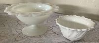 Both milk-glass pieces side by side for scale and pattern detail