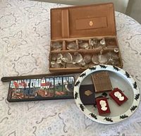 All items overview: cat bowl, chandelier prisms, cameo matchboxes, souvenir box, pointer, miniature book, wood comb