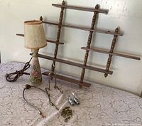 Entire lot showing shelf, lamp, display stand, lamp parts and charms