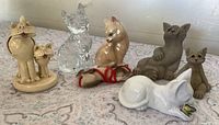 Group shot of all seven cat ornaments