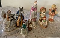 All six figurines displayed together on table