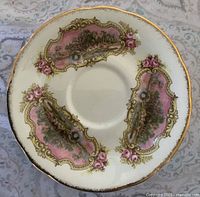Front of Paragon Chippendale "C" saucer showing pattern and gold trim