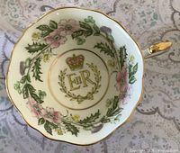 Interior showing floral garland, ER monogram, crown, gilt rim and handle