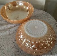 Two peach lustre bowls, interior view