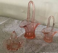 Three pink depression glass baskets group shot