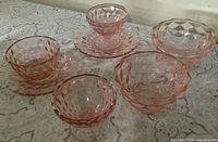 Full lot showing saucers, sherbet glasses, sugar bowls, teacup