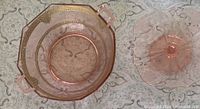 Top view of both pink depression glass pieces showing bowl with gold trim and pedestal plate
