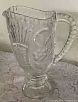 Full view of Zajecar lead crystal pedestal pitcher showing handle and floral panels