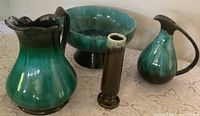 Group shot of all four glazed pottery pieces