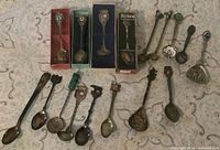 Full group of 17 souvenir spoons including four boxed and thirteen loose