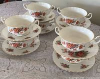 Stacked sets of bowls on saucers showing overall quantity and pattern
