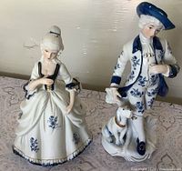 Front view of both figurines showing overall design and size