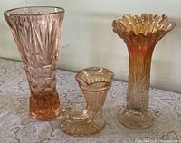Front view of all three vases upright
