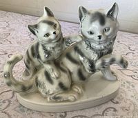 Front view of striped cat and kitten porcelain figurine