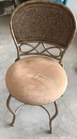Full view of metal vanity chair showing frame, seat, legs