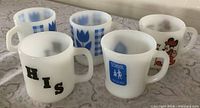 All five milk glass mugs grouped
