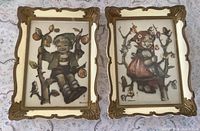 Both framed Hummel prints side by side