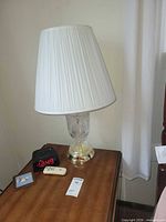 Full view of lamp on nightstand with shade
