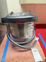 Front view of DonJoy IceMan CLEAR unit displaying branding and hose connection