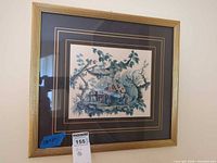Full view of framed pastoral print on wall
