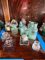 Group view of assorted ink bottles showing colors and shapes