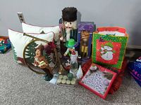 Group shot of entire lot with pillows, nutcrackers, horn, figurine, candles, Lenox box, gift bag