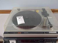 Front view showing full Kenwood KD-21R turntable with dust cover closed