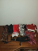 All accessories laid out: neckties, bow ties, cummerbund, suspenders, pocket squares