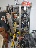 Full view of gray steel shelving unit loaded with tools (contents not included)