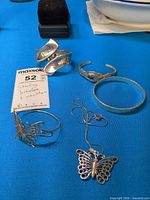 Overview of all sterling silver jewellery pieces on blue background